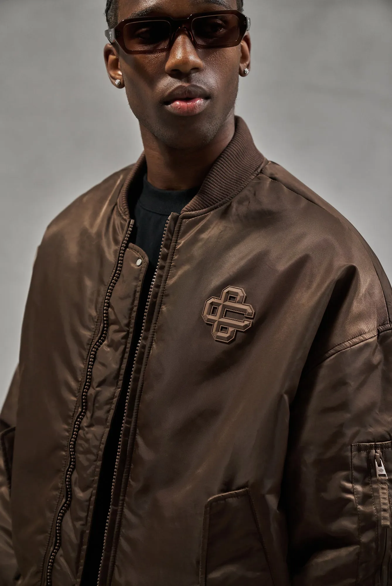 OVERSIZED EMBLEM BOMBER JACKET - BROWN